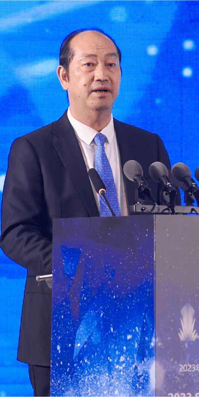  man in a business suit delivering a speech at a maritime event podium