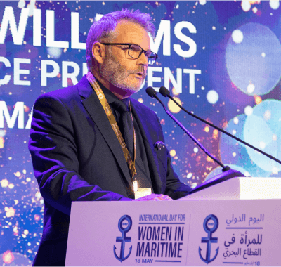 man presenting at a podium 